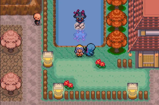 Pokemon Heart & Soul overworld scene with the player beside a following Pokemon near water and autumn trees